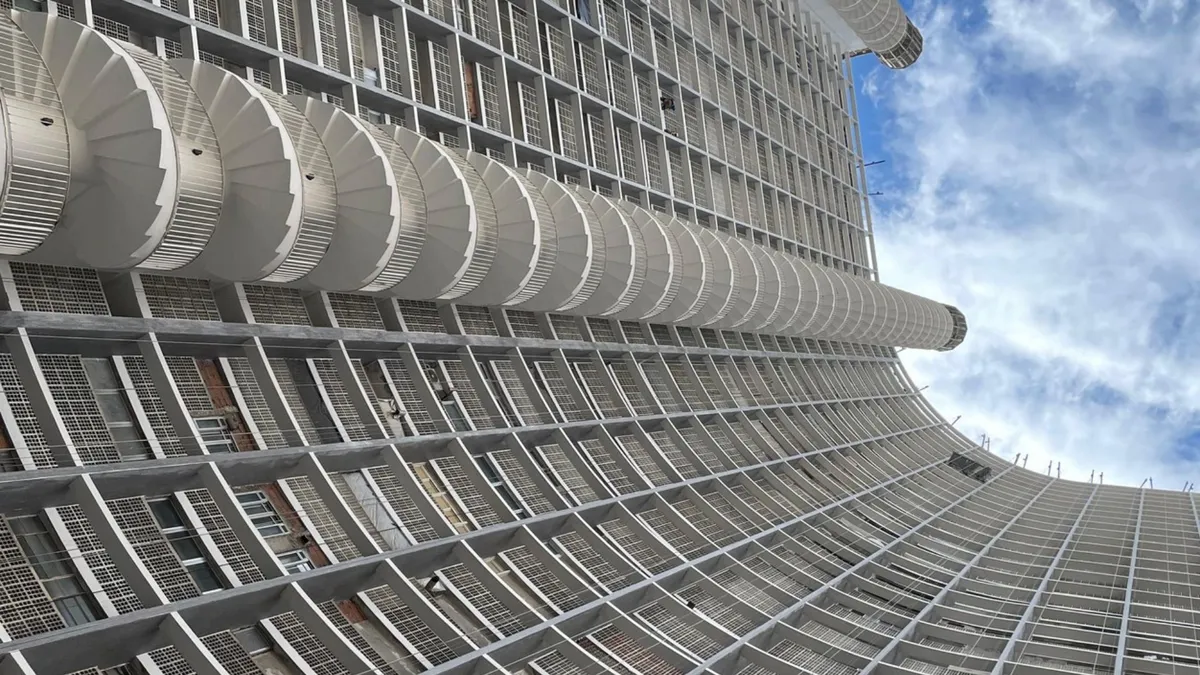 Impressive view of the building's spiral staircase from the bottom to the very top